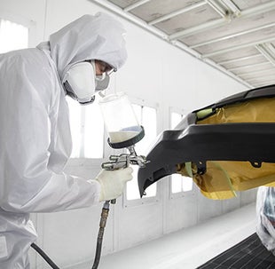Collision Center Technician Painting a Vehicle | Marianna Toyota in Marianna FL