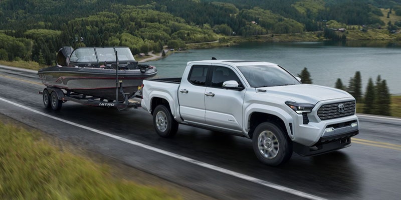 2024 Toyota Tacoma towing a boat.