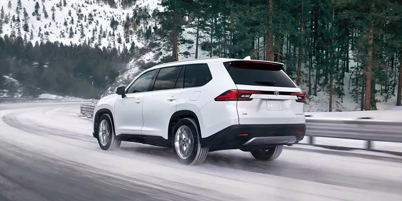 2024 Toyota Grand Highlander driving on snow